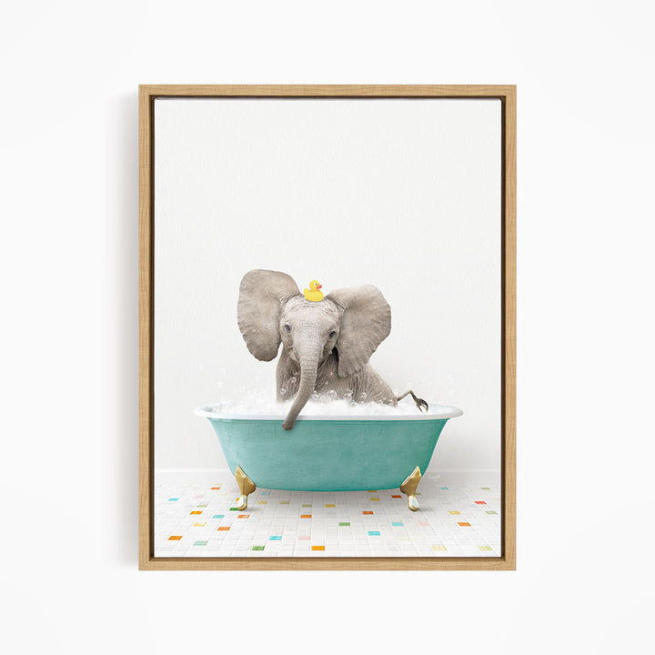 A gray elephant is sitting in a blue bathtub filled with water, with a yellow rubber duck perched on its head.
