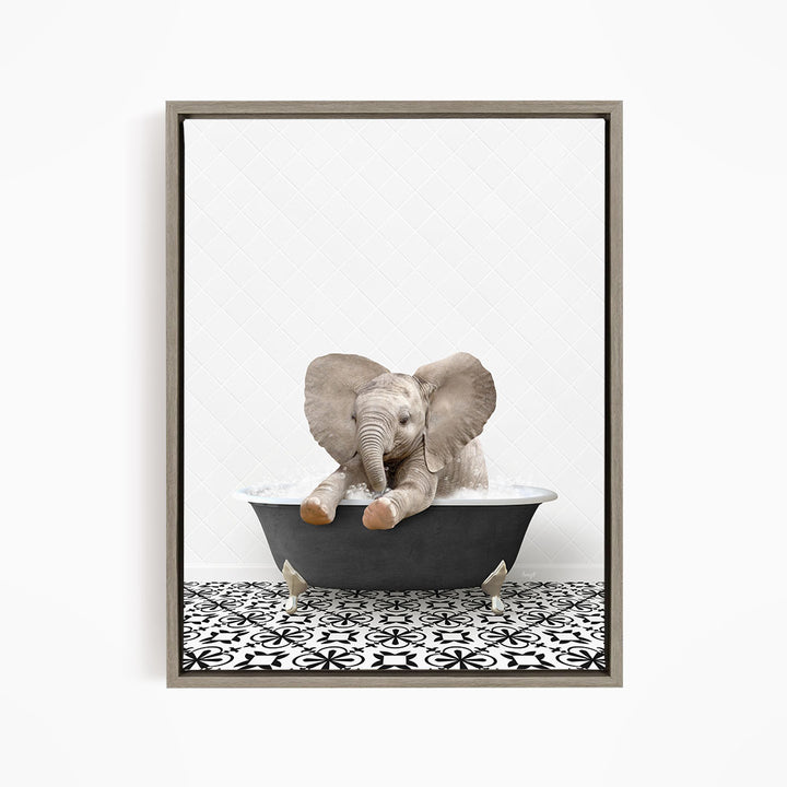 A baby elephant sitting in a bathtub filled with water, surrounded by a black and white patterned floor.