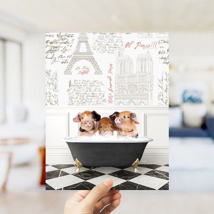 A hand is holding up a collage of images featuring three pigs sitting in a bathtub, with the Eiffel Tower and other Parisian landmarks visible in the background.