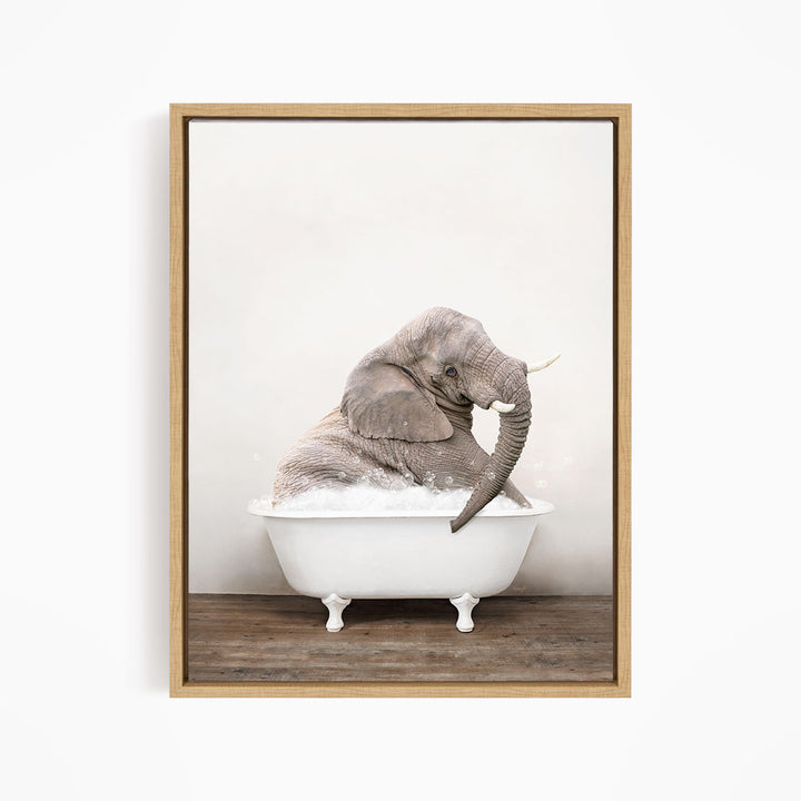 A gray elephant sitting in a white bathtub filled with water, creating a whimsical and playful scene.