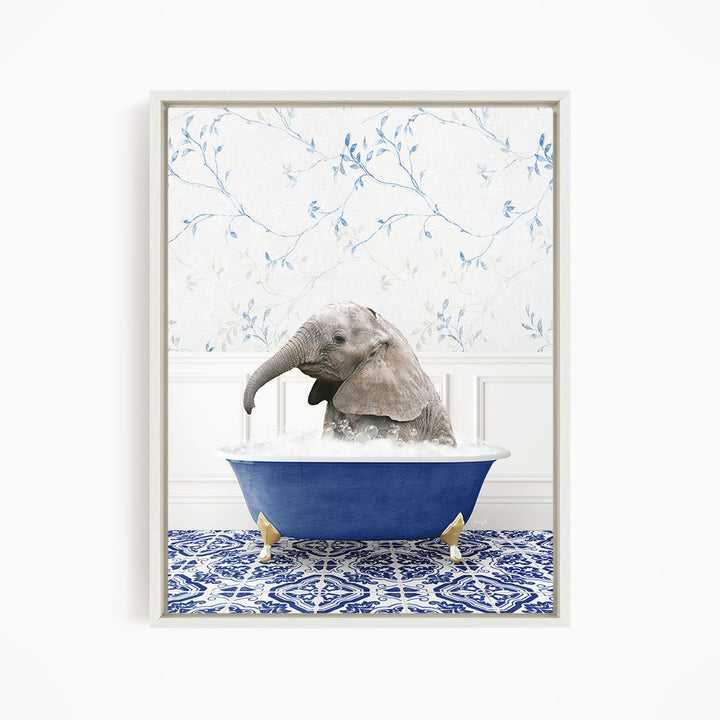 A baby elephant sitting in a blue bathtub filled with water, surrounded by a blue and white patterned floor.