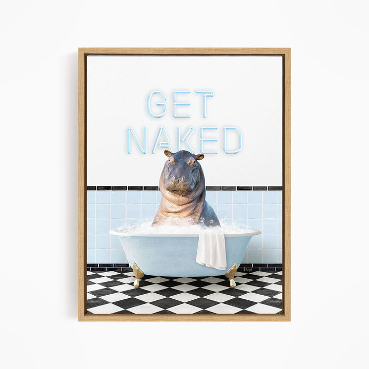 A framed image depicting a hippopotamus sitting in a bathtub with the text "GET NAKED" displayed above it.