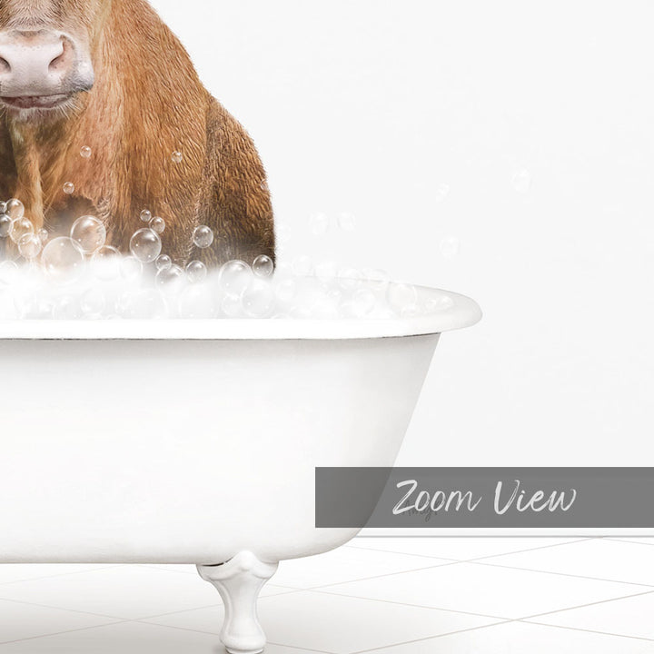 A brown cow is sitting in a white bathtub filled with bubbles, creating a whimsical and playful scene.