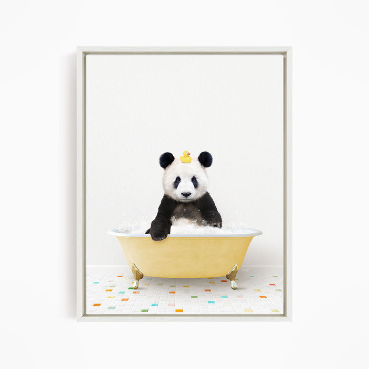 A panda bear sitting in a yellow bathtub, with a rubber duck on its head.