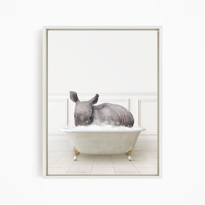 A rhinoceros is sitting in a white bathtub filled with water, creating a whimsical and playful scene.