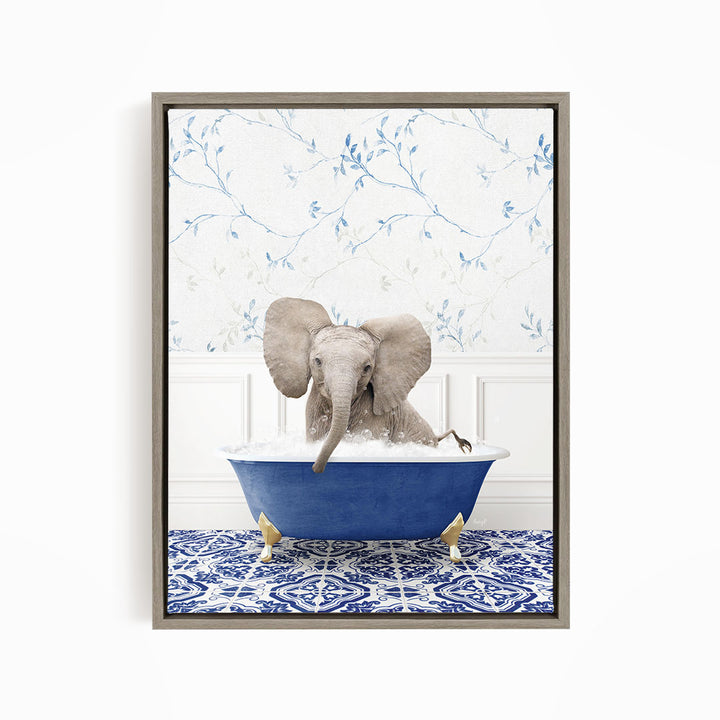 A gray elephant is sitting in a blue bathtub filled with water, surrounded by a blue and white patterned floor.