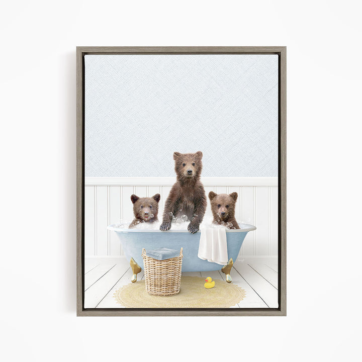 A framed image depicting three bears sitting in a bathtub, with one bear sitting in the center and the other two bears sitting on either side.