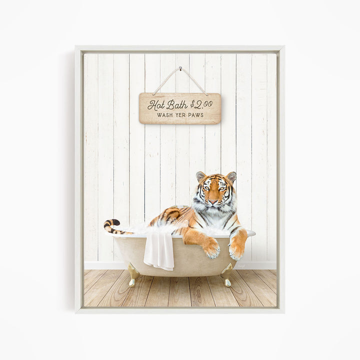 A tiger is sitting in a bathtub, with a sign above it that reads "Hot Bath $2.00 WASH YOUR Paws".