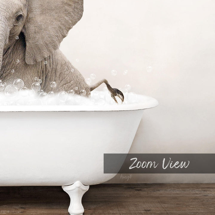 An elephant is sitting in a white bathtub filled with bubbles, creating a whimsical and playful scene.