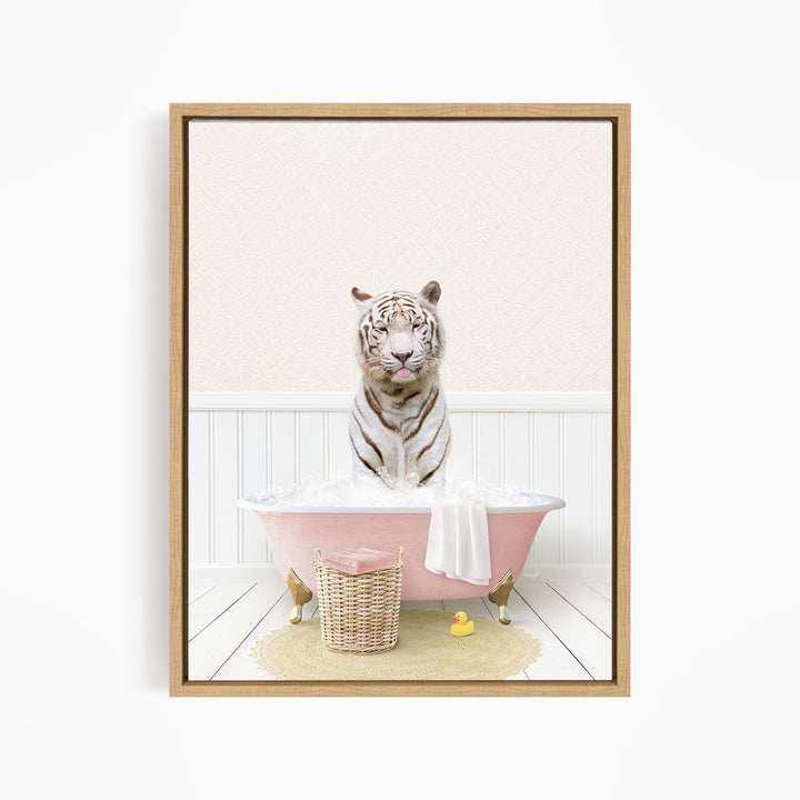 A white tiger is sitting in a pink bathtub filled with water, surrounded by rubber ducks.