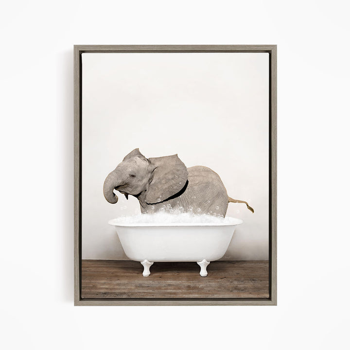 A gray elephant is standing in a white bathtub filled with water, creating a whimsical and playful scene.