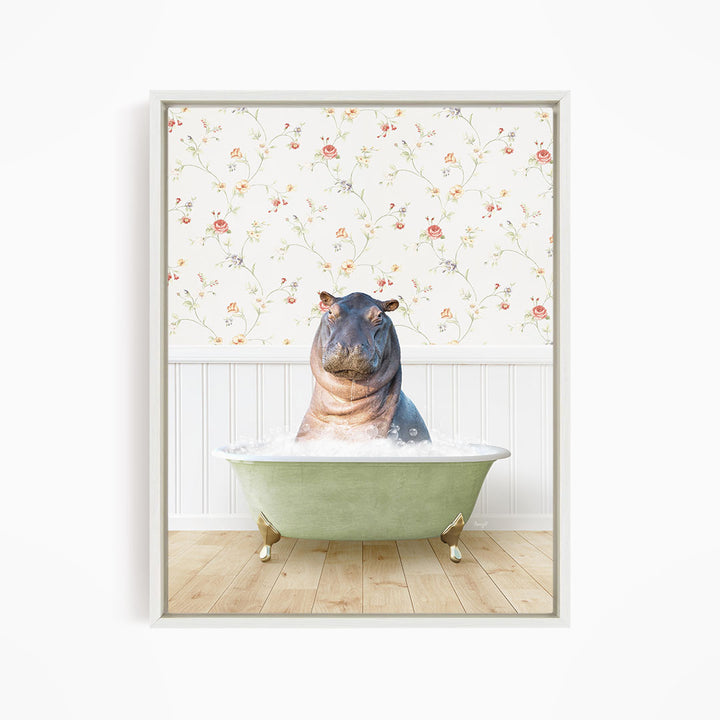 A hippopotamus sitting in a green bathtub filled with water, surrounded by a floral wallpaper.