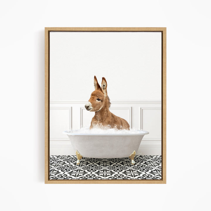 A donkey is sitting in a white bathtub filled with bubbles, creating a playful and whimsical scene.