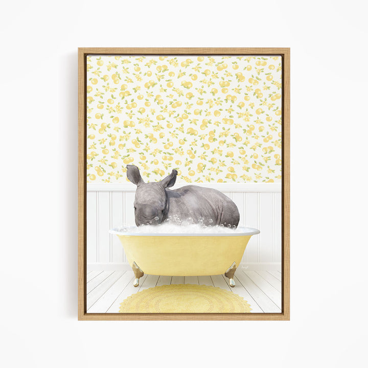 A rhinoceros is sitting in a yellow bathtub, surrounded by a yellow and white floral pattern on the wall behind it.