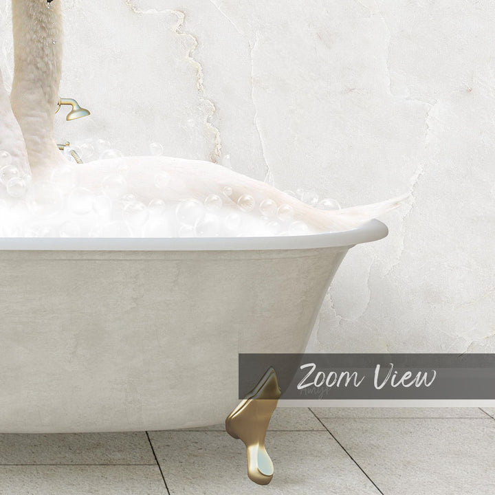 A white bathtub filled with bubbles, with a gold bathtub faucet and a gold bathtub claw visible.