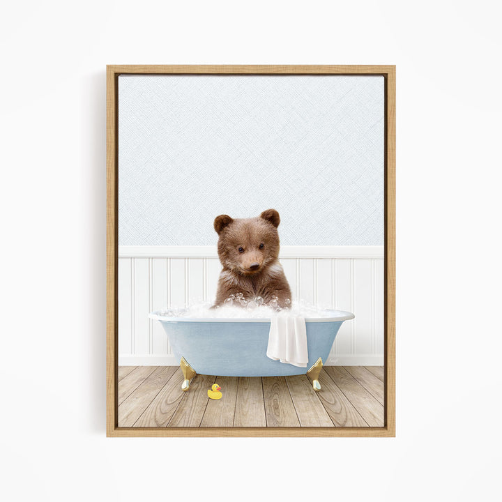 A brown bear sitting in a blue bathtub filled with water, surrounded by rubber ducks.
