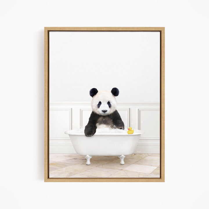 A panda bear sitting in a white bathtub, with a rubber duck floating in the water.