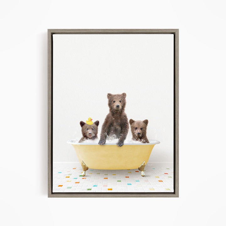 A framed image depicting three bears sitting in a yellow bathtub, with one bear sitting in the center and the other two bears sitting on either side.