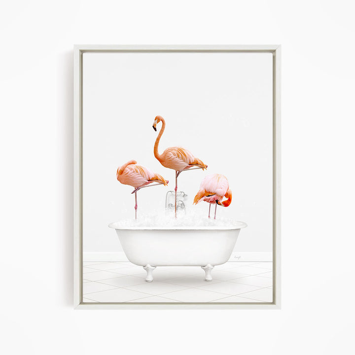 A framed image depicting three flamingos standing in a white bathtub filled with water.