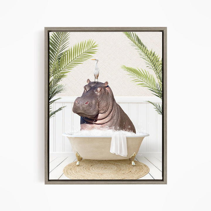 A framed image depicting a hippopotamus sitting in a bathtub, with a bird perched on its head.