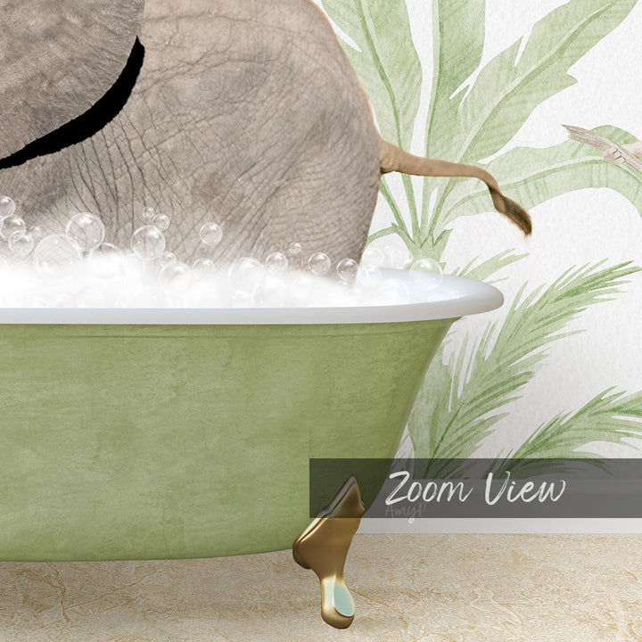 A green bathtub filled with bubbles, with a large elephant's trunk submerged in the water.