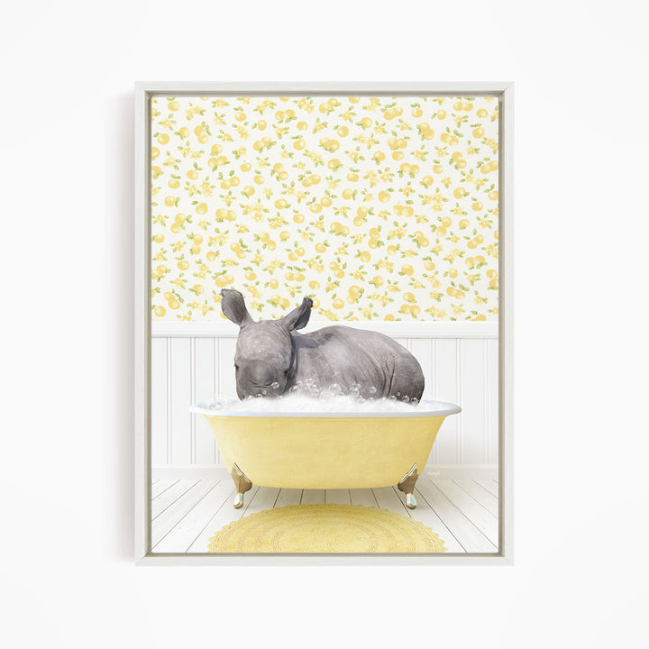 A rhinoceros is sitting in a yellow bathtub filled with water, surrounded by a yellow floral wallpaper.