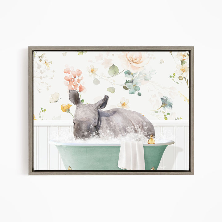 A rhinoceros is sitting in a green bathtub filled with bubbles, surrounded by a floral background.