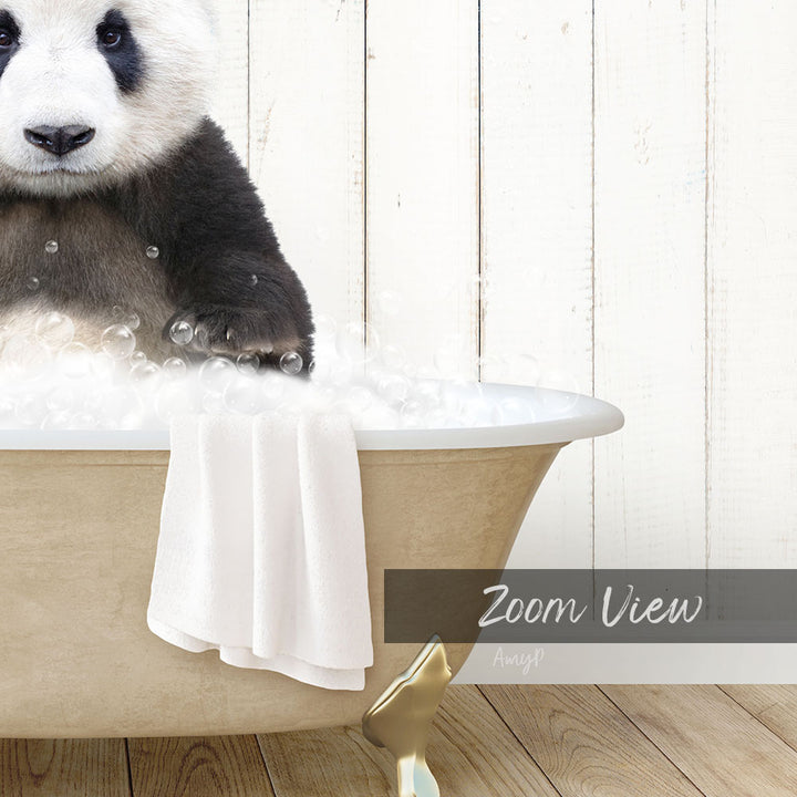 A panda bear sitting in a bathtub filled with bubbles, with a towel and a wooden wall in the background.