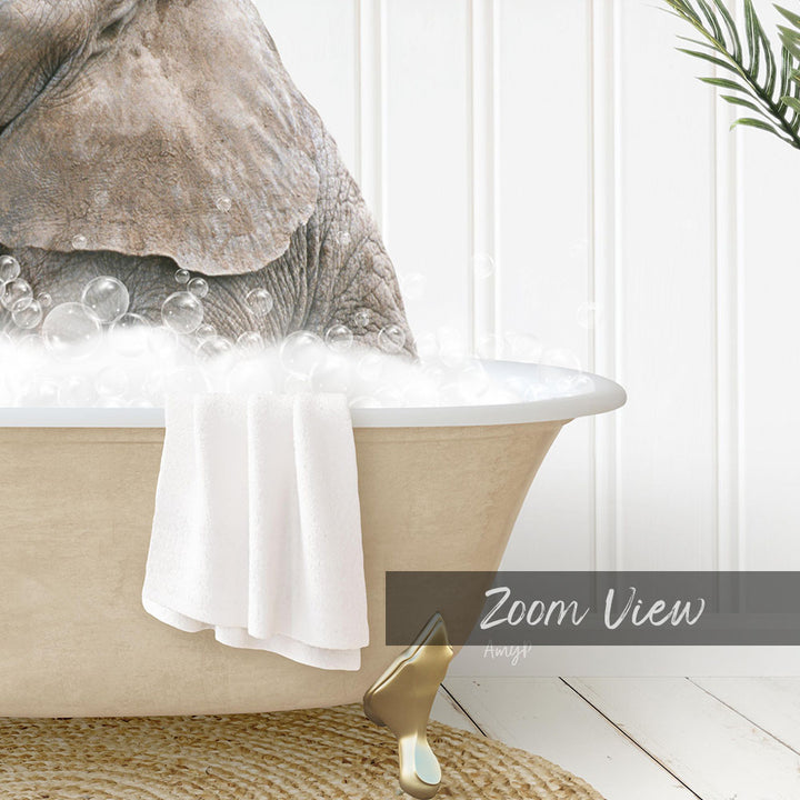 A large elephant is sitting in a bathtub filled with bubbles, with a towel draped over the side and a gold object on the floor next to the tub.
