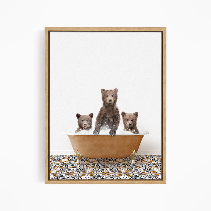 A framed image depicting three bears sitting in a bathtub filled with water.