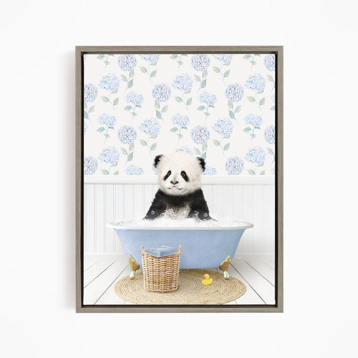 A cute panda bear sitting in a blue bathtub filled with bubbles, surrounded by a wicker basket and yellow rubber ducks.