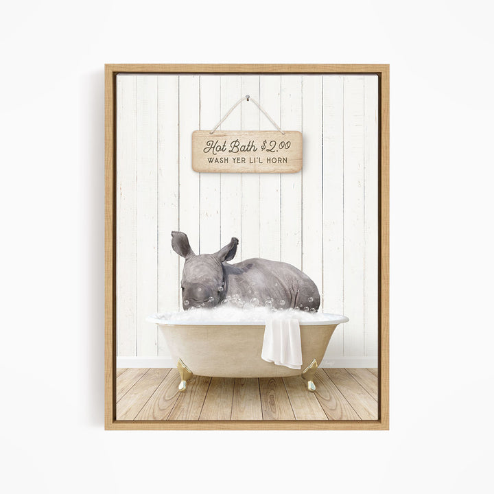 A rhinoceros is sitting in a bathtub filled with water, with a sign above it that reads "Hot Bath $2.00 WASH YER LITT LOHN".