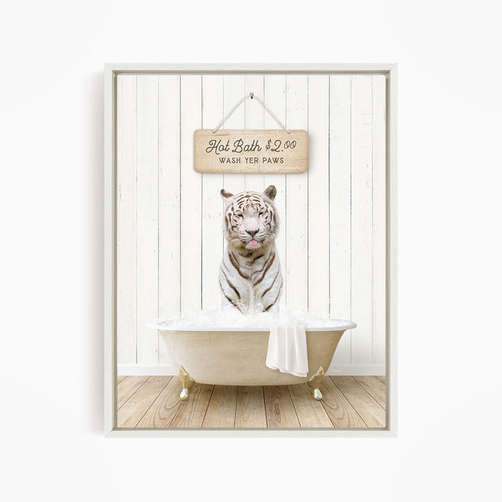A white tiger sitting in a bathtub, with a sign above it that says "Hot Bath $2.00 WASH YOUR Paws".