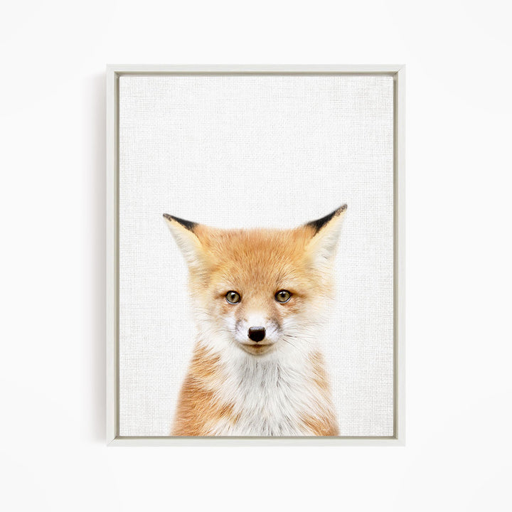 A framed print of a young fox with a friendly expression, looking directly at the camera.