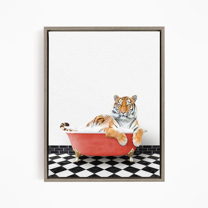 A tiger is sitting in a red bathtub on a black and white checkered floor.