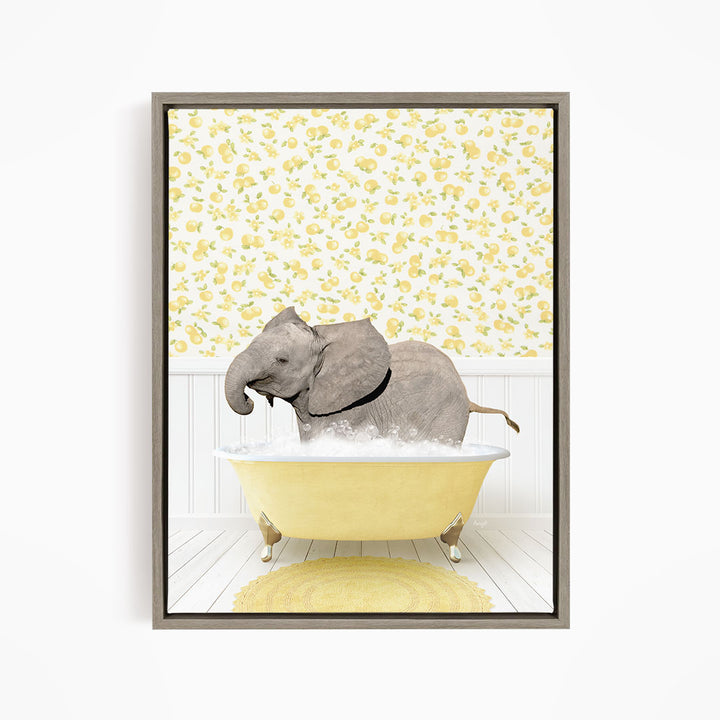A gray elephant is sitting in a yellow bathtub filled with water, surrounded by a yellow floral pattern on the wall behind it.