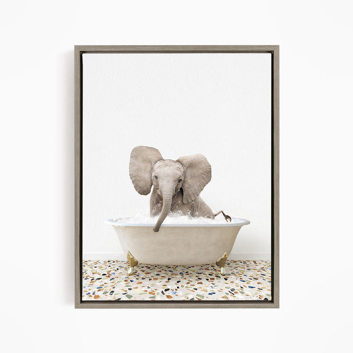 A baby elephant sitting in a bathtub filled with water, surrounded by a speckled floor.