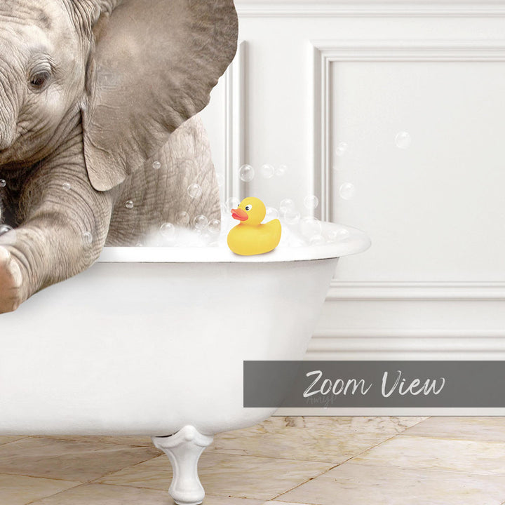 A baby elephant sitting in a bathtub, with a yellow rubber duck floating on the water.