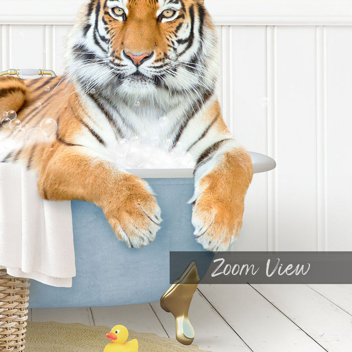 A tiger is sitting in a bathtub filled with water, surrounded by a rubber duck and a towel.
