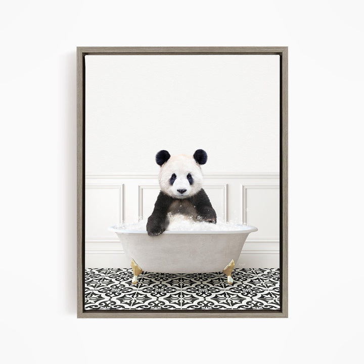 A panda bear sitting in a white bathtub filled with bubbles, surrounded by a black and white patterned floor.
