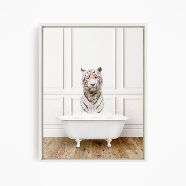 A white tiger is sitting in a white bathtub filled with water, creating a whimsical and playful scene.