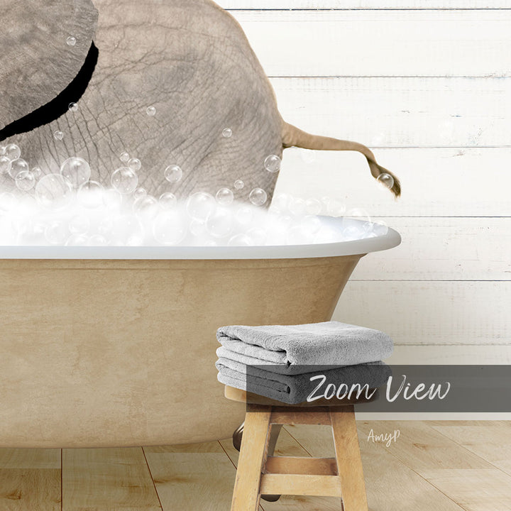 A large elephant is taking a bath in a bathtub filled with bubbles, with a towel and stool visible in the foreground.