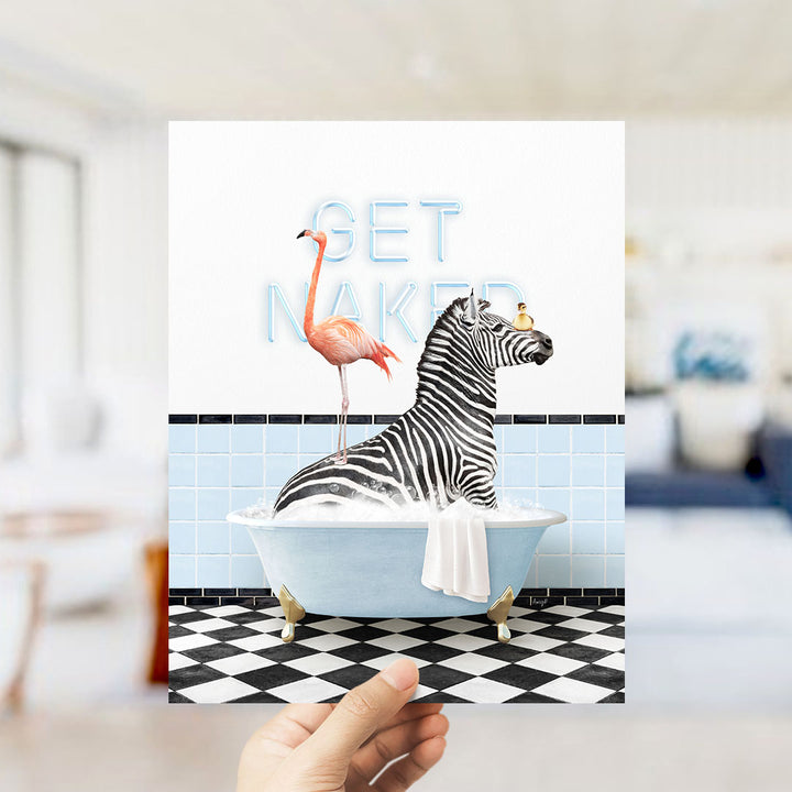 A hand is holding up a print featuring a zebra sitting in a bathtub with a pink flamingo standing on its back.