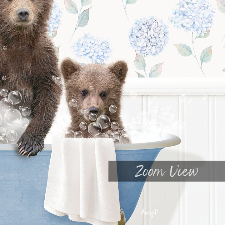 A brown bear and a baby bear are sitting in a blue bathtub filled with bubbles, with a floral patterned wall in the background.