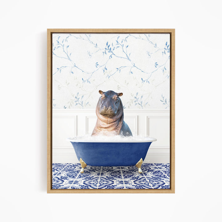 A hippopotamus sitting in a blue bathtub, surrounded by a patterned tile floor and a floral wallpaper background.