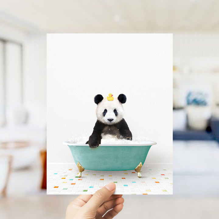 A panda bear sitting in a green bathtub with a yellow rubber duck on its head.