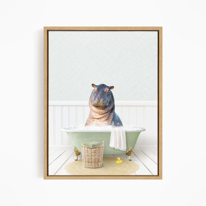 A hippopotamus sitting in a green bathtub filled with water, surrounded by a basket of toys and a yellow rubber duck.