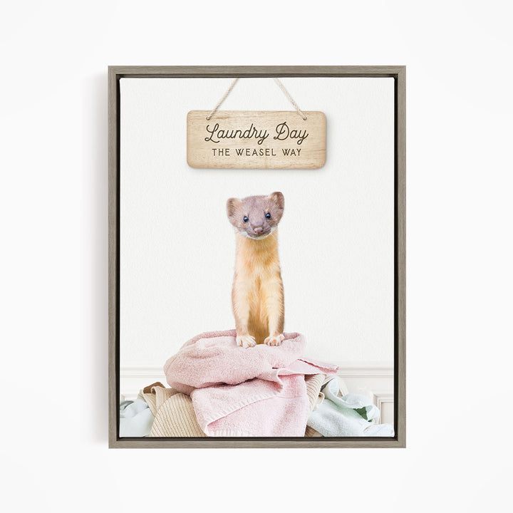 A weasel standing on a pile of clothes with a wooden sign above it that says "Laundry Day The Weasel Way".