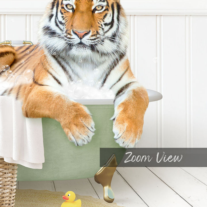 A tiger is sitting in a bathtub filled with water, surrounded by a rubber duck and a towel.