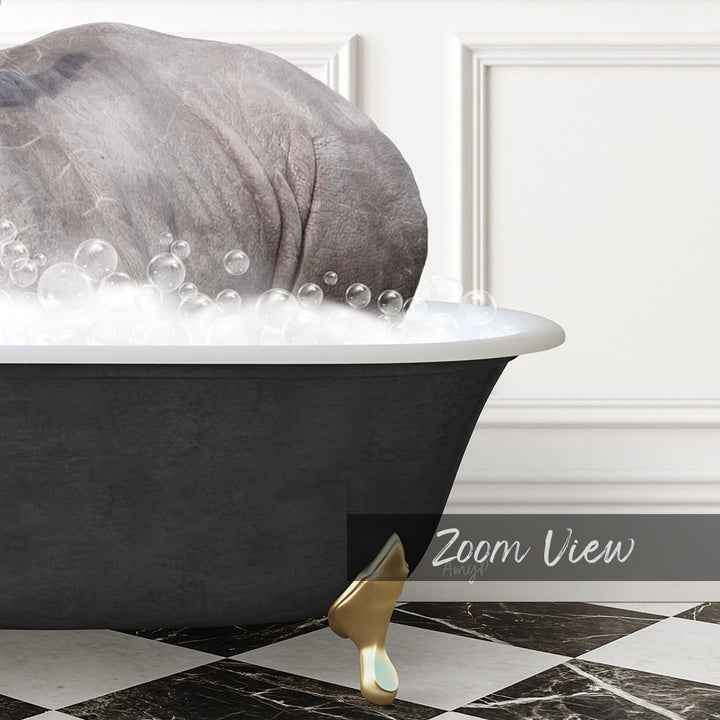 A black bathtub filled with bubbles, with a gold bathtub leg visible, and a gold bathtub leg in the foreground.